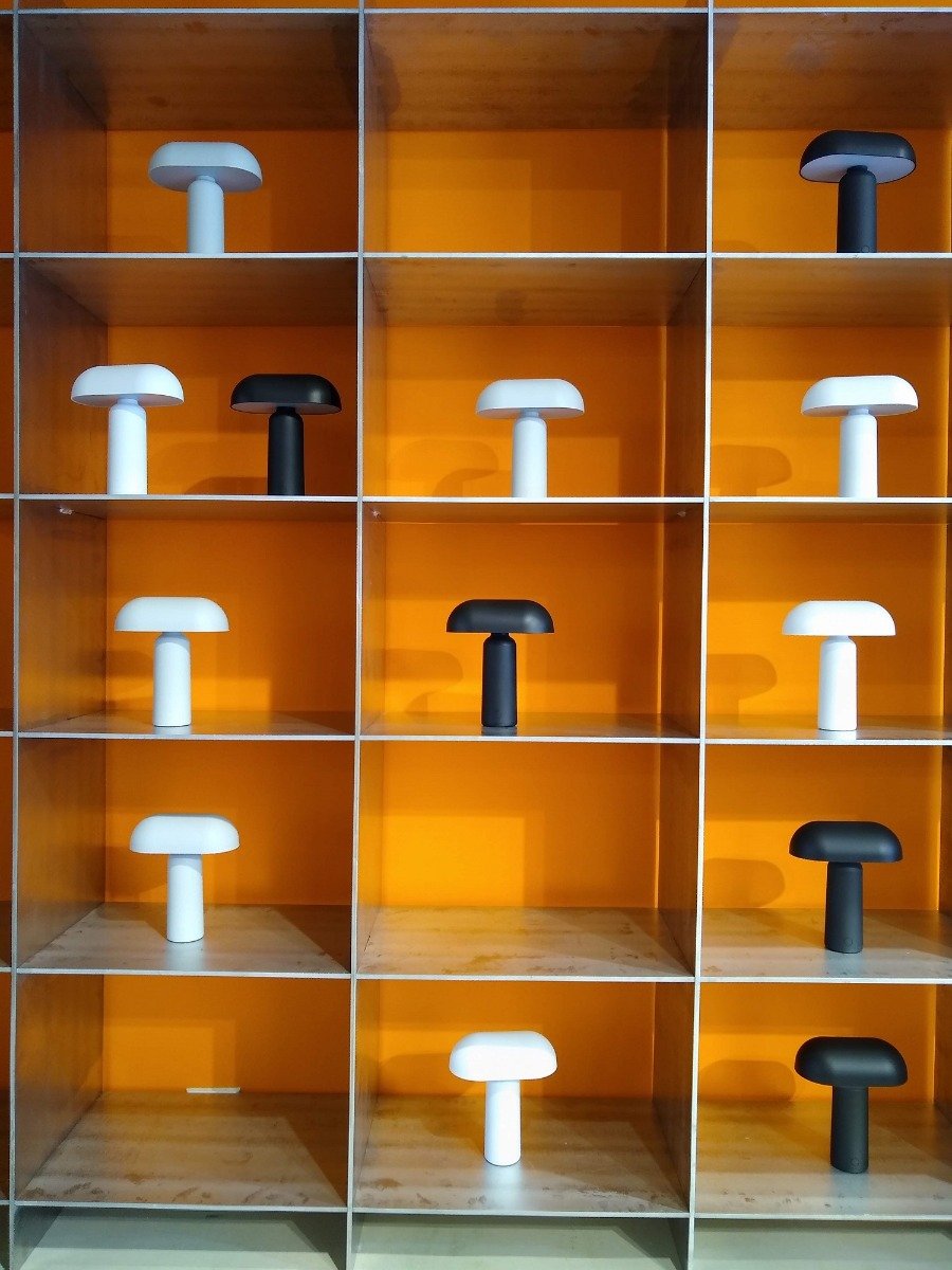 small portable lamps in a grid formation cabinet
