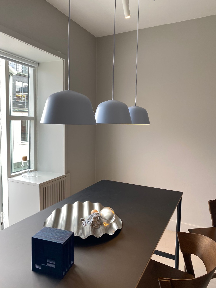 Muuto Ambit pendants over dining table