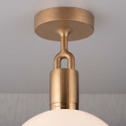 Close Up of Buster + Punch Forked Globe Ceiling Light Brass Fixture