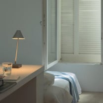 Santa & Cole Gira Mini Portable Lamp in Bedroom