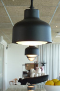 Zero Lens small pendant black in situ above a bar