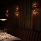 3 Skyline Wall Lights in Brass in a Restaurant