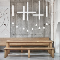 White Brokis Puro LED Pendants over Dining Table