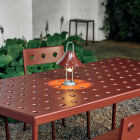 HAY Mousqueton Portable Lamp on Outdoor Table (Iron Red)