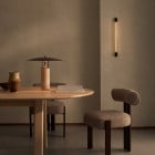 J. Adams & Co Strata 600 LED Wall Light Beside Table