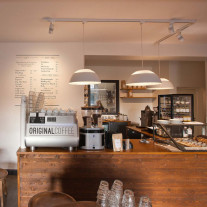 White Louis Poulsen AJ Royal LED Pendant Lights in Coffee Shop