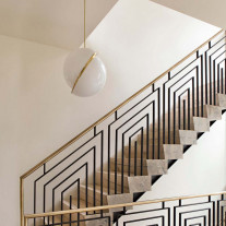 Lee Broom Crescent Pendant Over a Staircase
